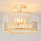 Gold-frame chandelier with vertical glass panels in a modern circular design, LED 3-light glow.