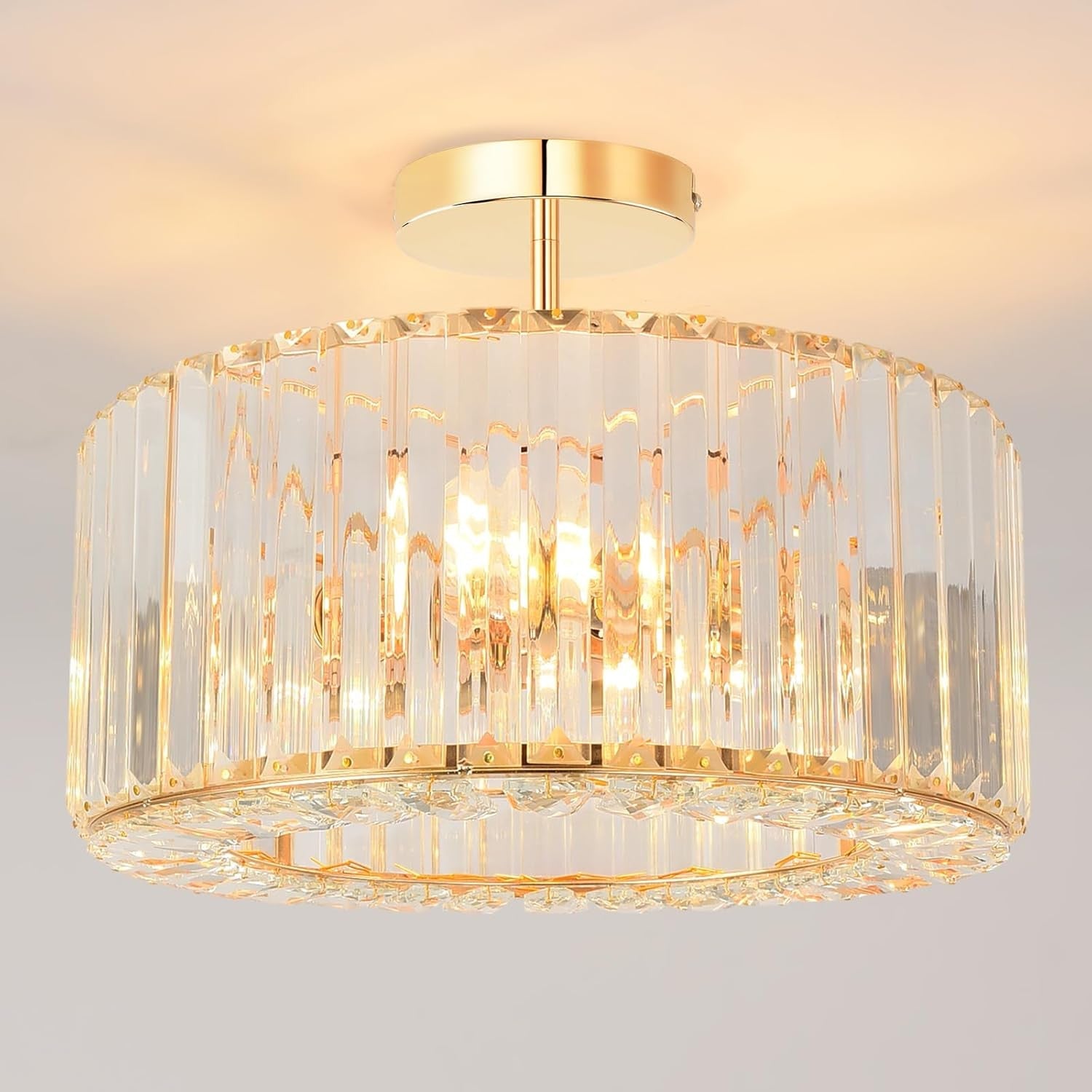 Gold-frame chandelier with vertical glass panels in a modern circular design, LED 3-light glow.