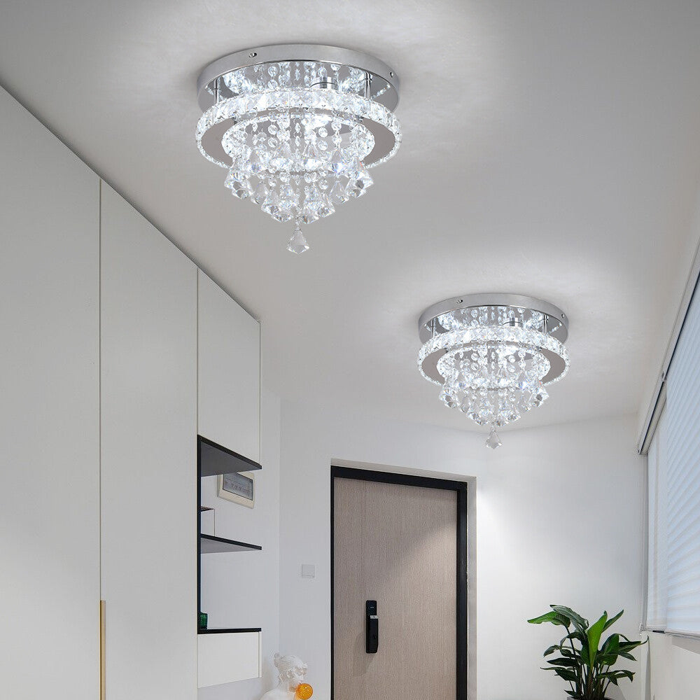 Two Maison Ornate Crystal Ball Chandeliers with LED, contemporary design, suspended from a white ceiling.