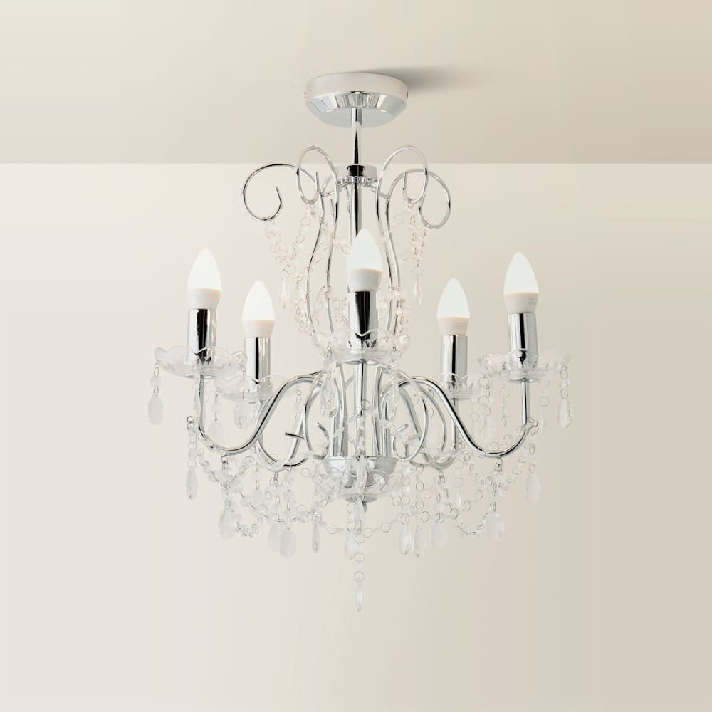 Maison Ornate Chrome Crystal Chandelier with five candle-style LED bulbs, chrome arms, and hanging crystals.
