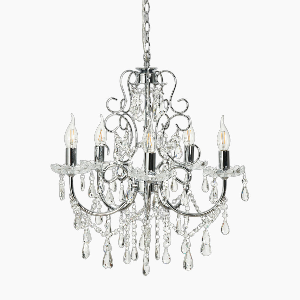 Five-light antique crystal chandelier with polished chrome arms and hanging clear crystals and chains.