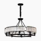 Ornate black metal chandelier with two glass prism tiers, circular frame, and central suspension rod.
