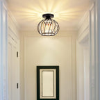 Maison Ornate Black Metal Crystal Industrial Mini Pendant chandelier with decorative light patterns.