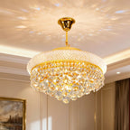 Elegant Empire-style gold and crystal chandelier by Maison Ornate, sparkling ornately from ceiling.