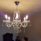 Maison Ornate Crystal Chandelier with chrome frame, K9 beads, six bulbs, and patterned ceiling mount.