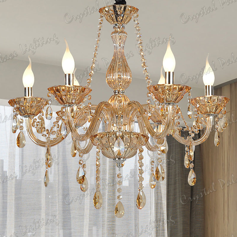 Ornate gold chandelier with multiple arms, K9 crystal teardrop pendants, elegant E14 bulb holders.