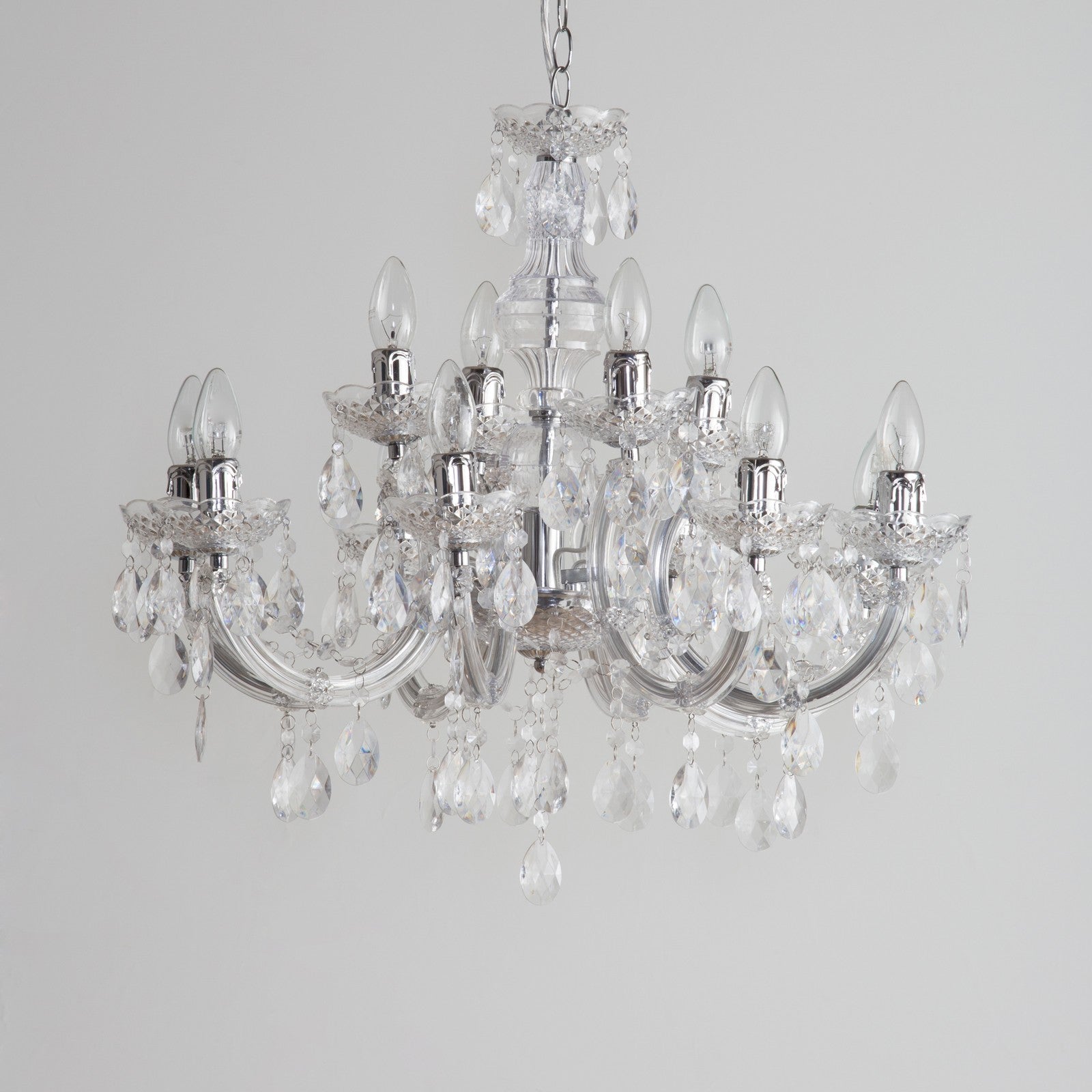 Maison Ornate Art Deco crystal chandelier with chrome arms, candle bulbs, and hanging droplets.
