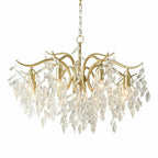 8-arm gold crystal chandelier with curved arms and cascading clear crystals, suspended by chain.