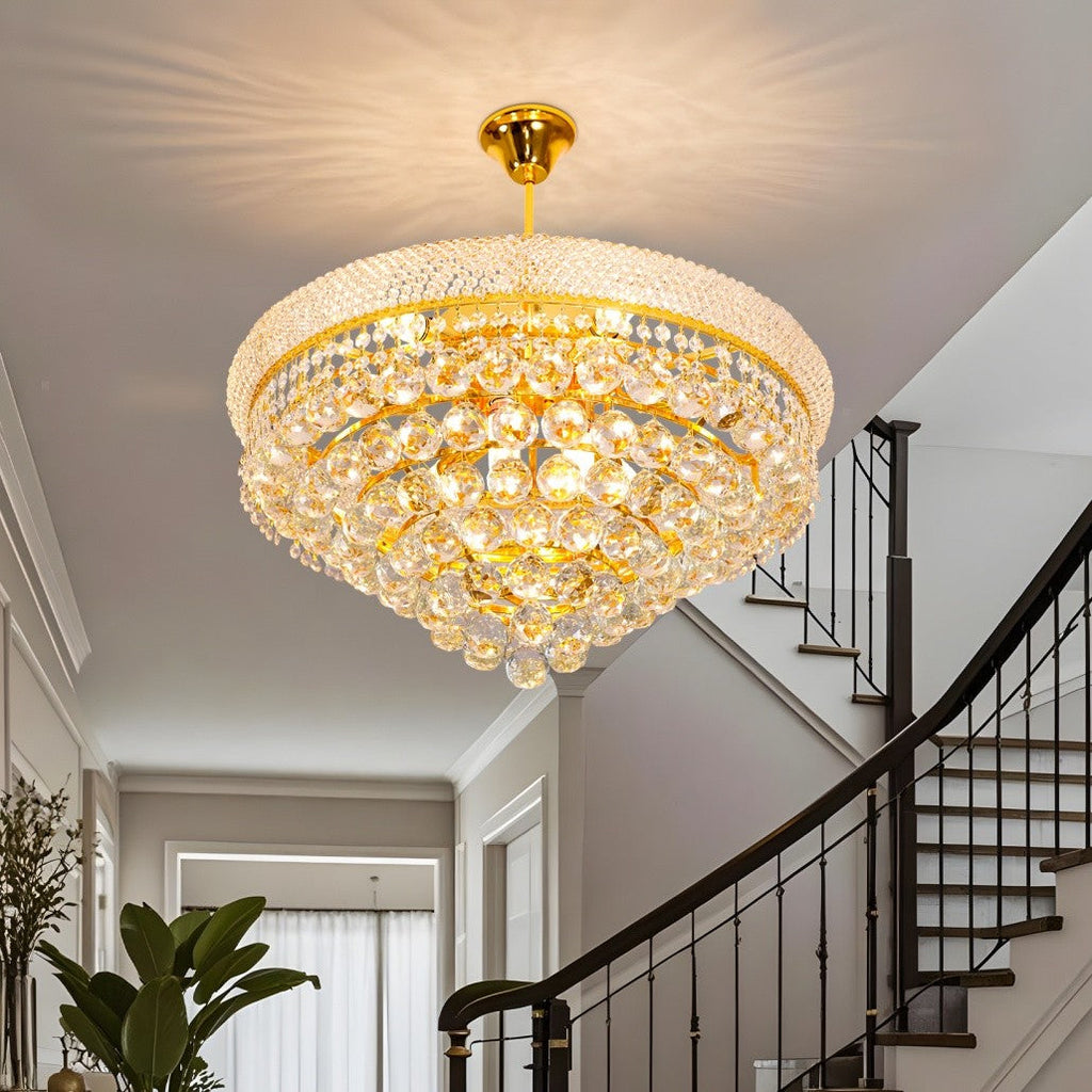 Maison Ornate Elegant Empire Style chandelier with gold finish and crystal details, providing warm illumination.