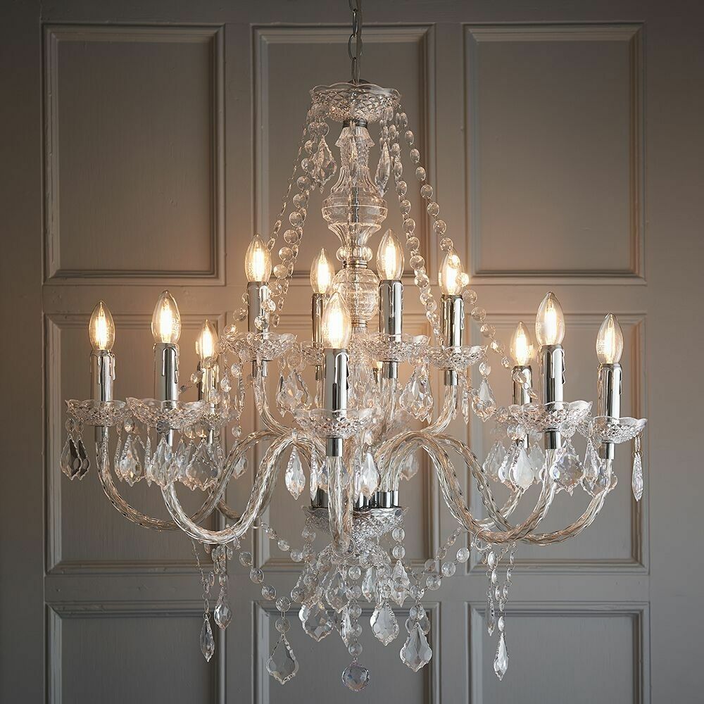 Maison Ornate Modern Crystal Chandelier features 12 candle bulbs, crystal arms, beads, and sparkling prisms.