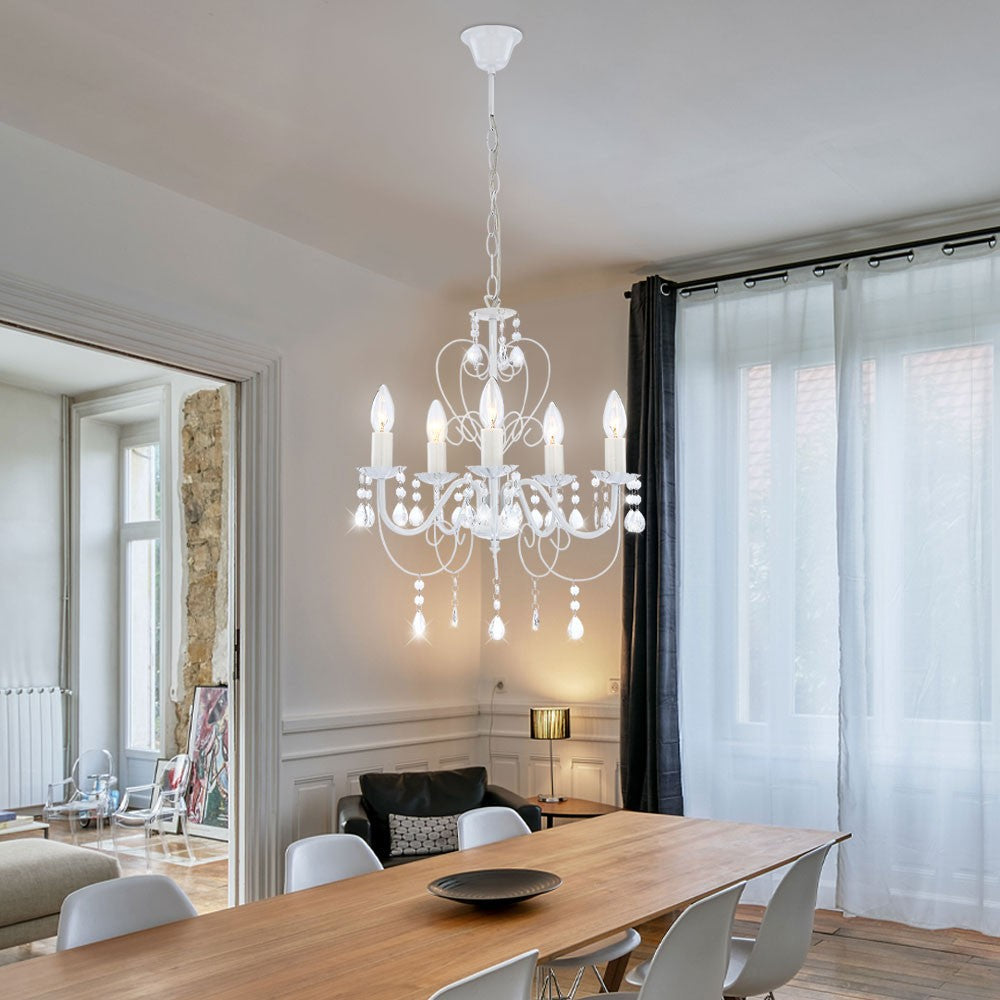 The Elegant Crystal Chandelier features white metal and a classic design by Maison Ornate.