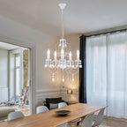 The Elegant Crystal Chandelier features white metal and a classic design by Maison Ornate.