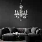 Elegant 5-branch crystal chrome chandelier by Maison Ornate with illuminated bulbs, modern and refined design.