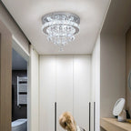 Maison Ornate's Crystal Ball Chandelier with LED Contemporary Design hanging in a modern hallway.