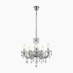 Chrome-finished five-arm chandelier with candle bulbs, sparkling crystals, and chain suspension for elegance.